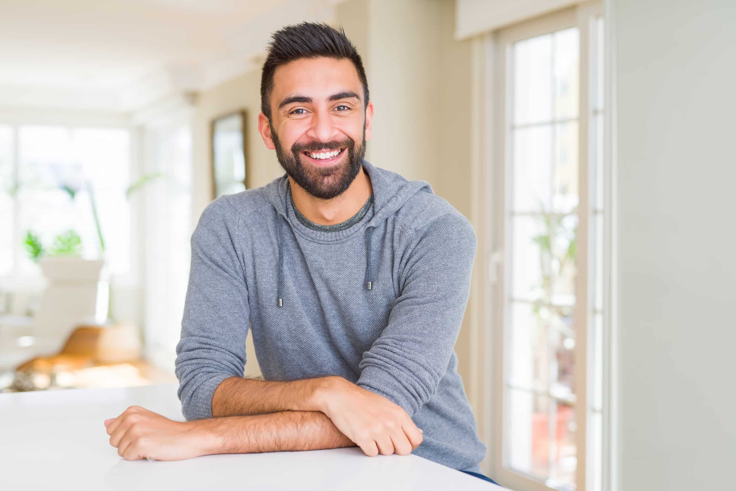 Handsome,Hispanic,Man,Wearing,Casual,Sweatshirt,At,Home,With,A